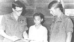 Maj. Robert Perez, 1Lt. Larry Pitts, and Nguyen Tan Hoang